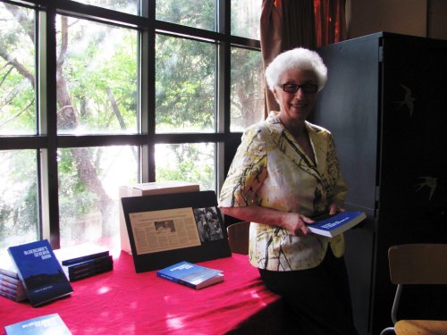 Eva displaying the novel "Blackbeard's Seventh Door"